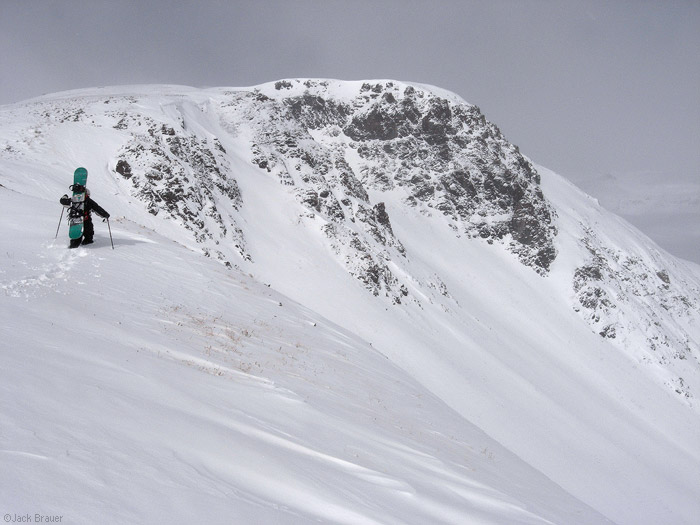 Hiking up snowy mountain