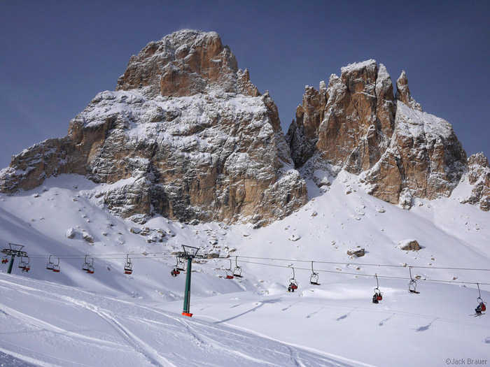 Chairlift under a couple of the rugged Sassolungo peaks.